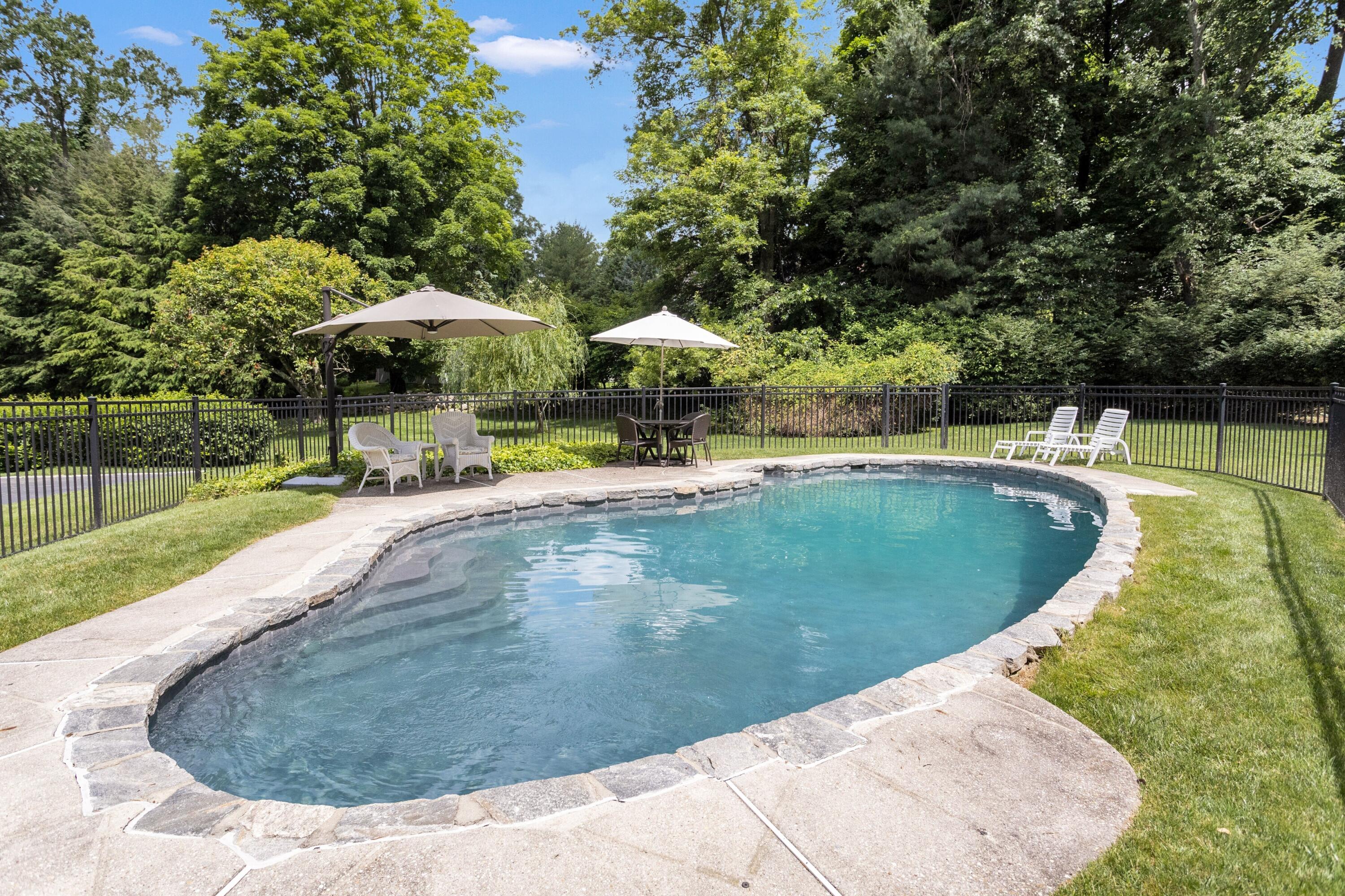 10 Wilson Ridge Road East Darien, CT 06820 - Photo 4 of 25 a view of a swimming pool with a patio