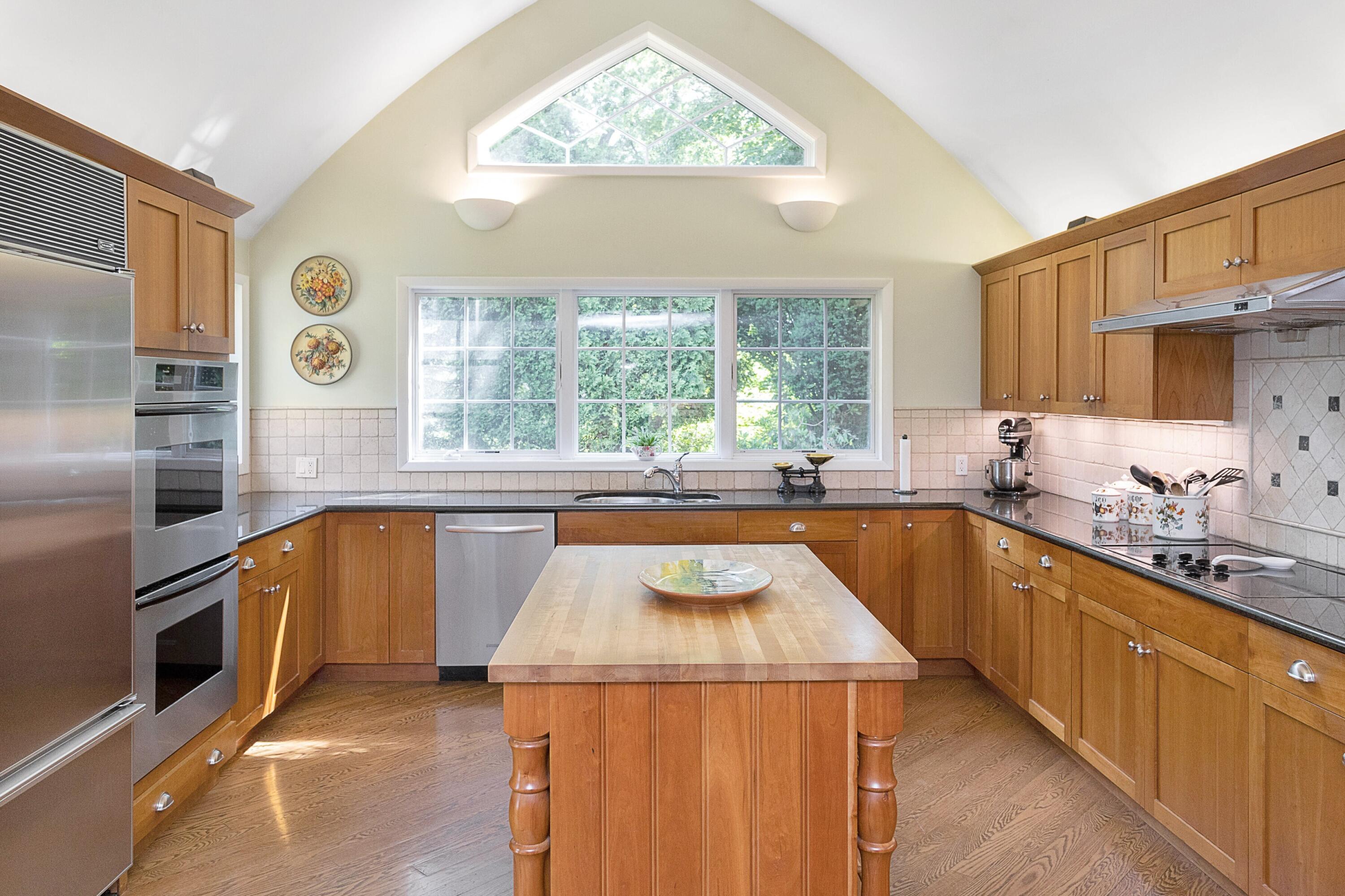 10 Wilson Ridge Road East Darien, CT 06820 - Photo 7 of 25 a kitchen with stainless steel appliances granite countertop a sink and a refrigerator