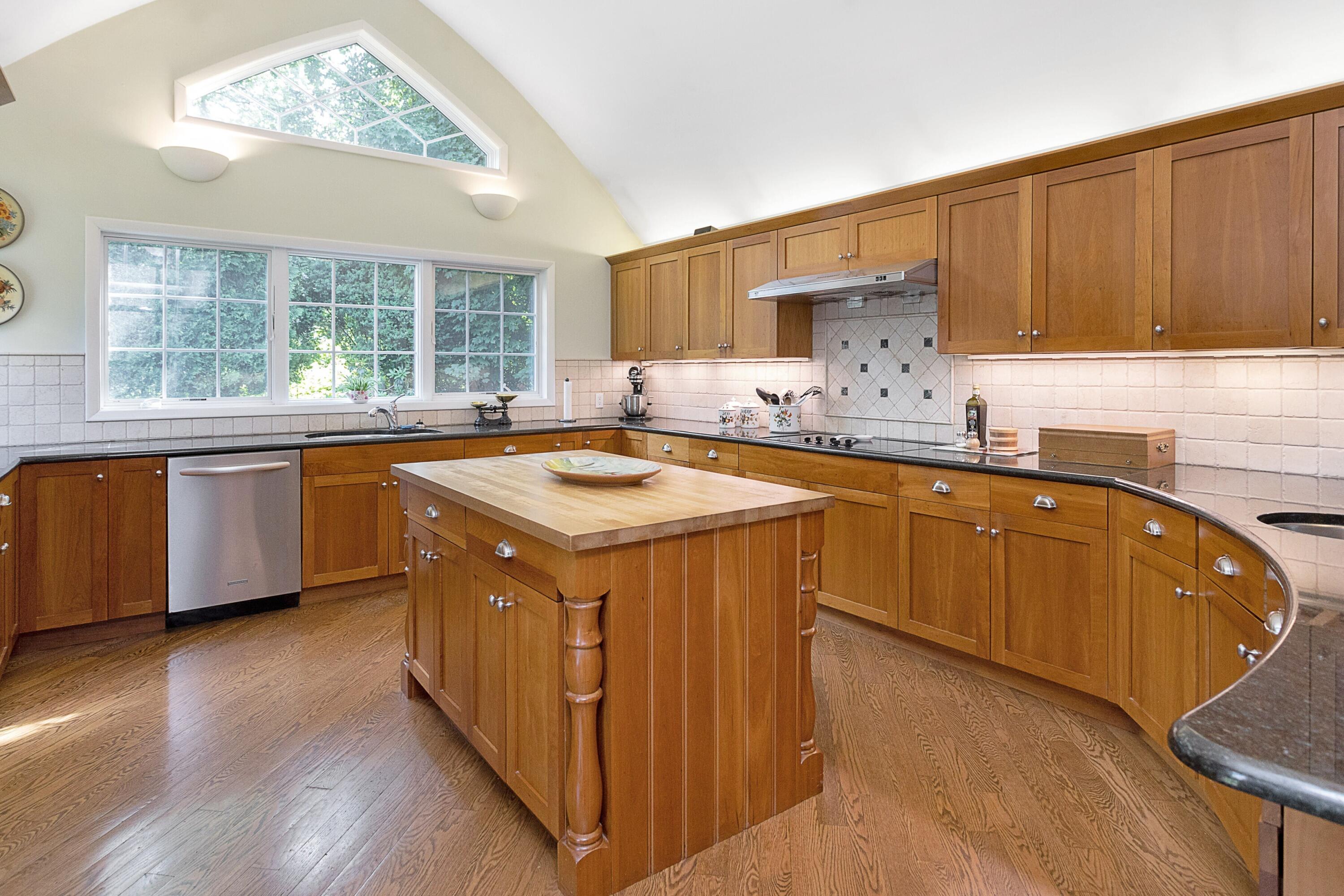10 Wilson Ridge Road East Darien, CT 06820 - Photo 8 of 25 a kitchen with wooden cabinets and sink