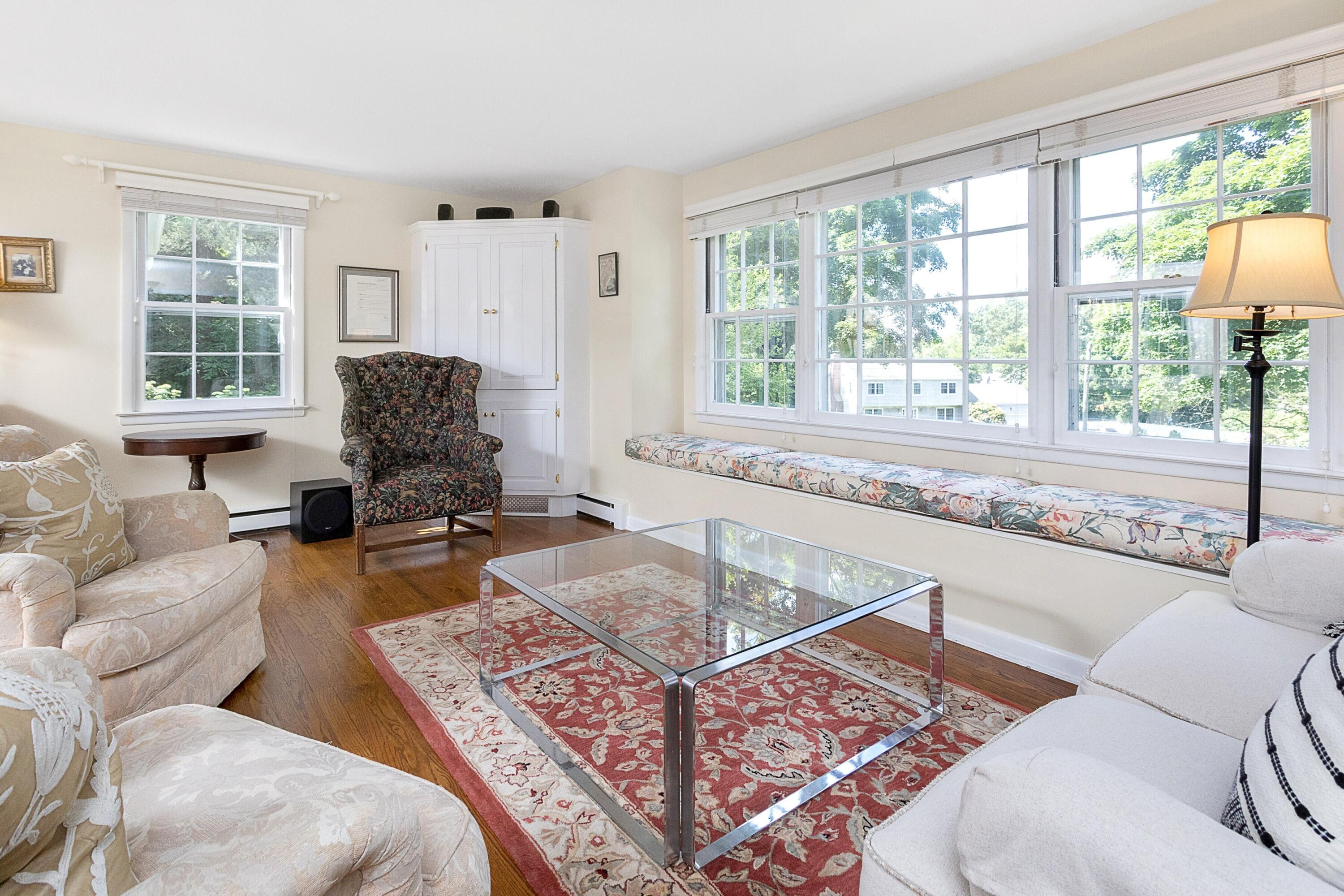 10 Wilson Ridge Road East Darien, CT 06820 - Photo 10 of 25 a living room with furniture and a large window
