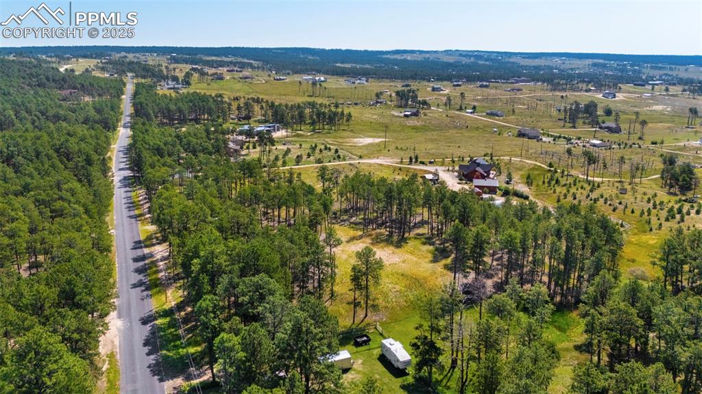 6225 Vessey Road Colorado Springs, CO 80908 - Photo 3 of 8 a view of a lake with houses in the back