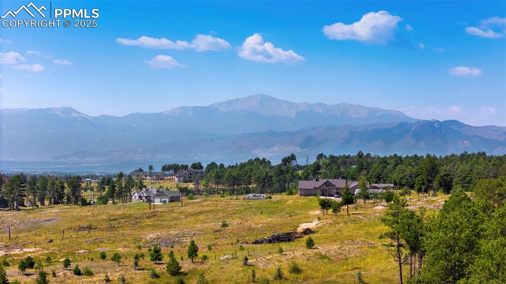 6225 Vessey Road Colorado Springs, CO 80908 - Photo 7 of 8 a view of a town with mountains in the background