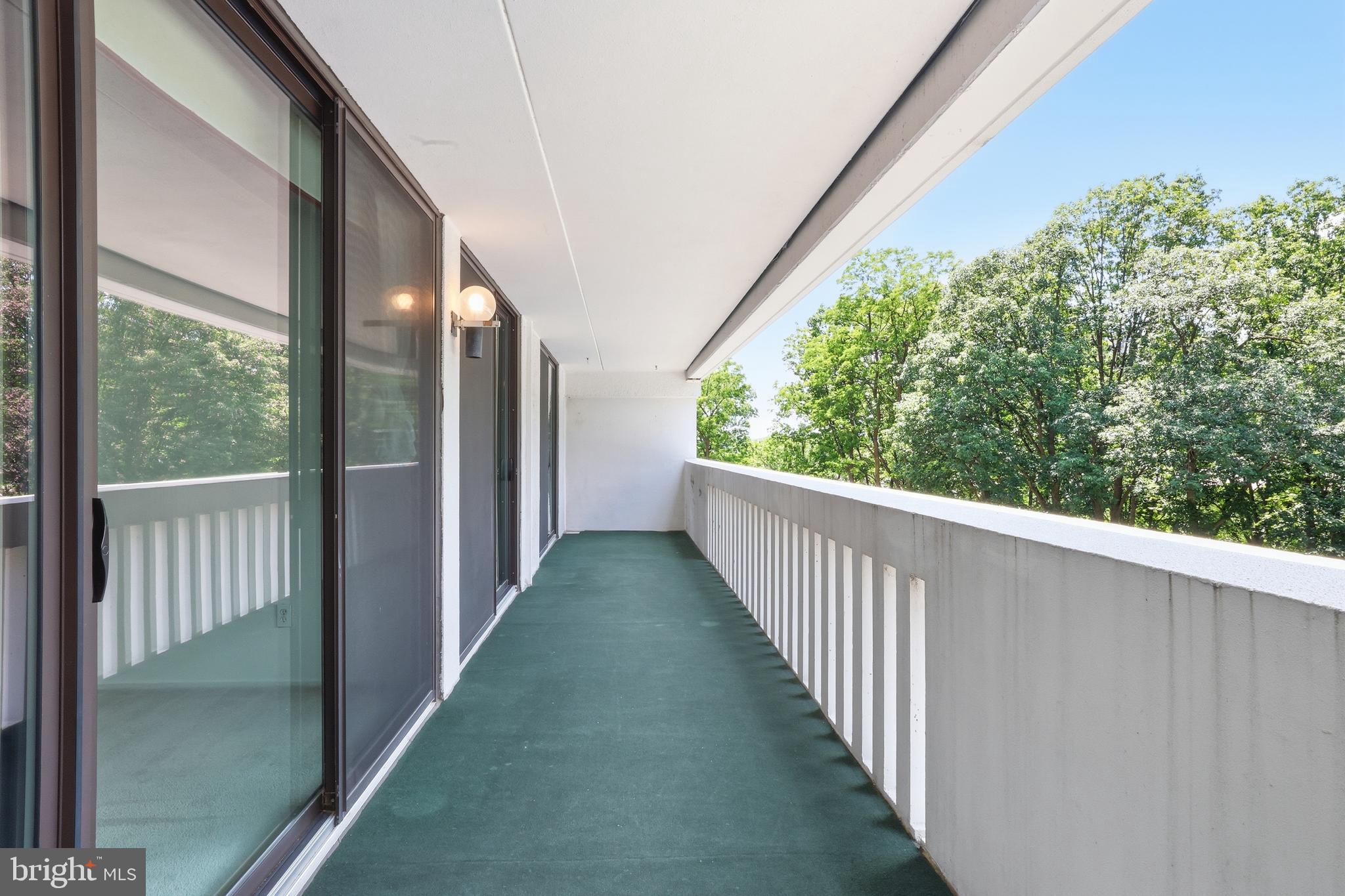 6101 Edsall Road, Unit 502 Alexandria, VA 22304 - Photo 4 of 33 Expansive West-facing balcony with sunset views