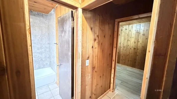 a view of a bathroom from a glass door