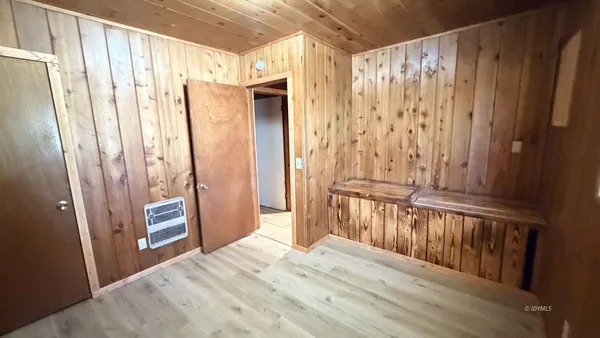 a view of a entryway with wooden walls