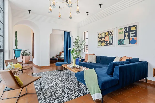 a living room with furniture and a window