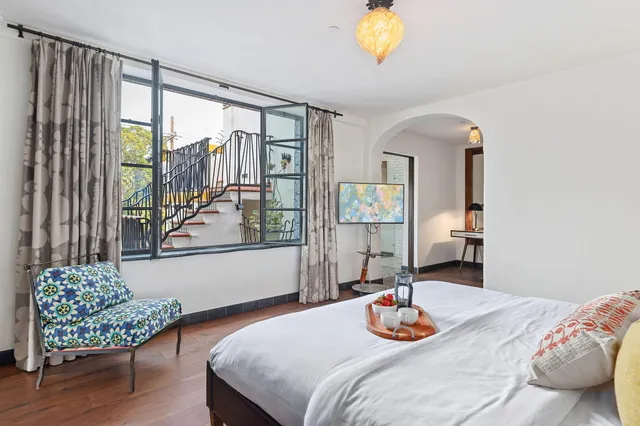 a dining room with furniture and wooden floor