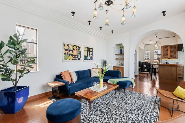 a living room with furniture and a large window
