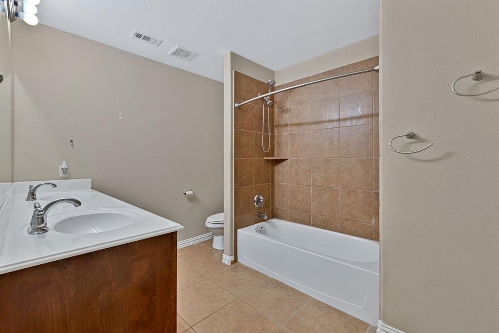 1701 Meadow Ranch Road McKinney, TX 75071 - Photo 29 of 40 a bathroom with a shower and a sink