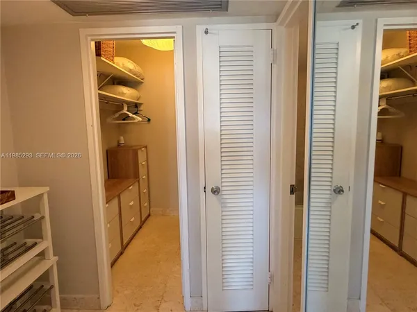 a view of a bathroom from a hallway
