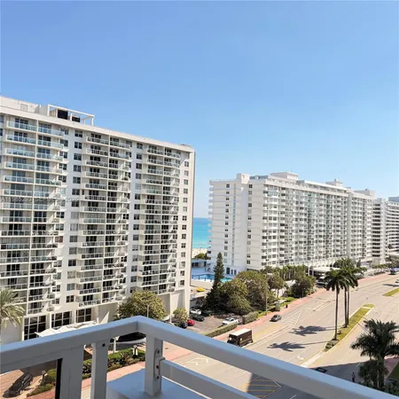 a view of balcony with a couple of buildings