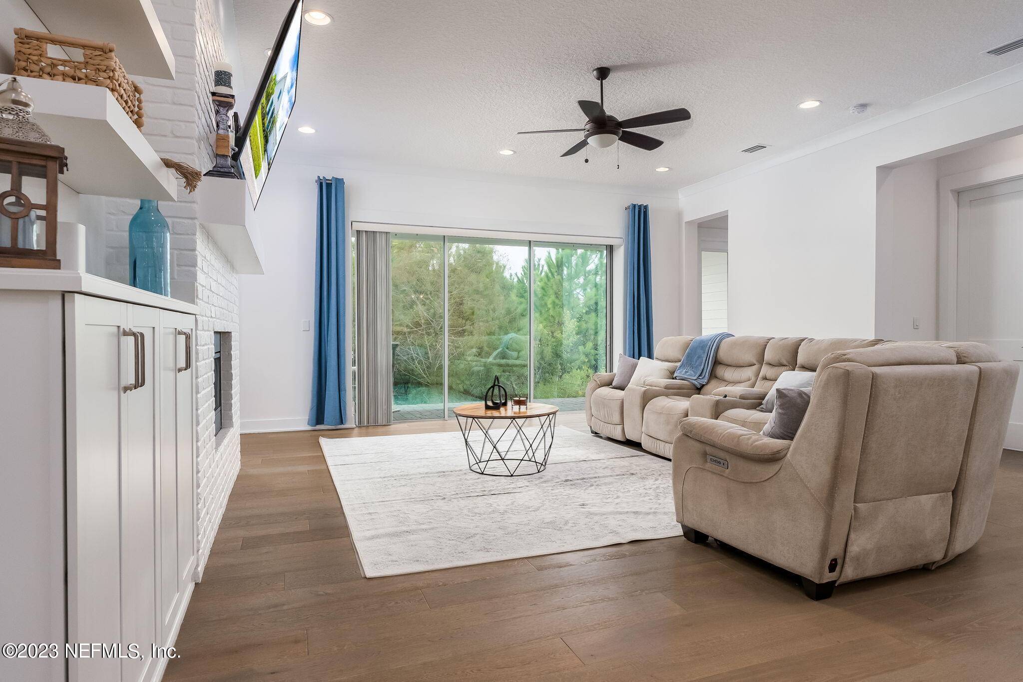 57 Topside Dr. St. Johns, FL 32259 - Photo 11 of 46 a living room with furniture and a chandelier