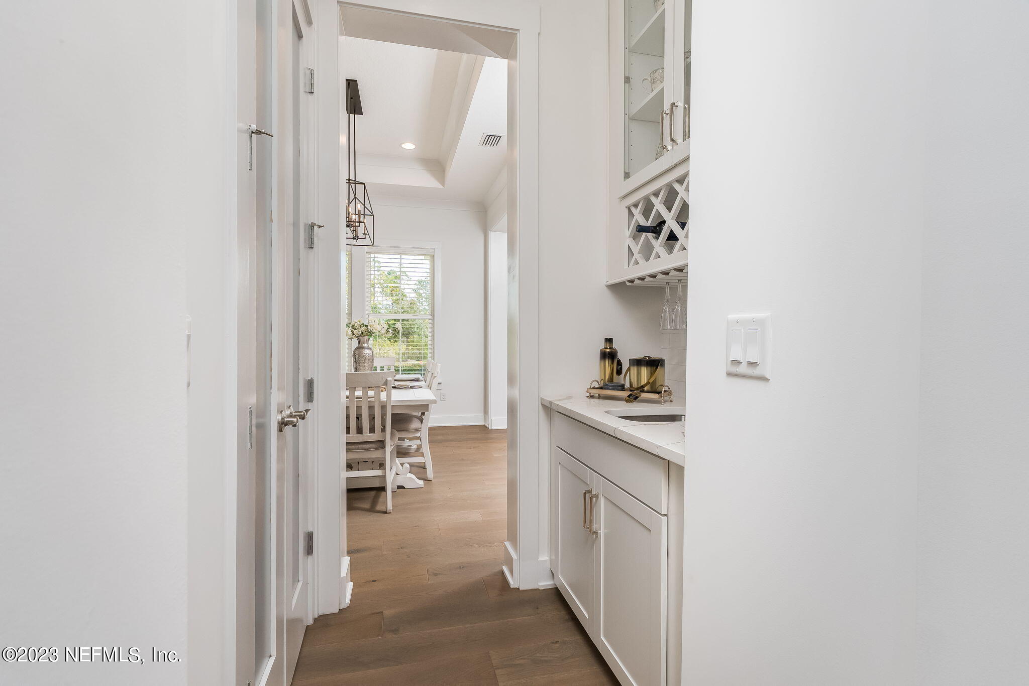 57 Topside Dr. St. Johns, FL 32259 - Photo 12 of 46 a kitchen with cabinets and wooden floor