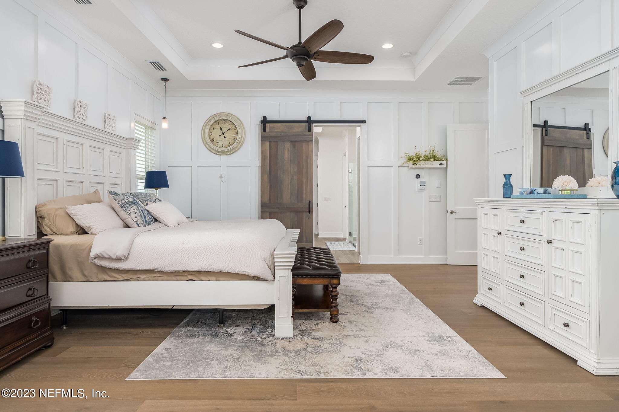 57 Topside Dr. St. Johns, FL 32259 - Photo 17 of 46 a bedroom with a bed a ceiling fan and a dresser