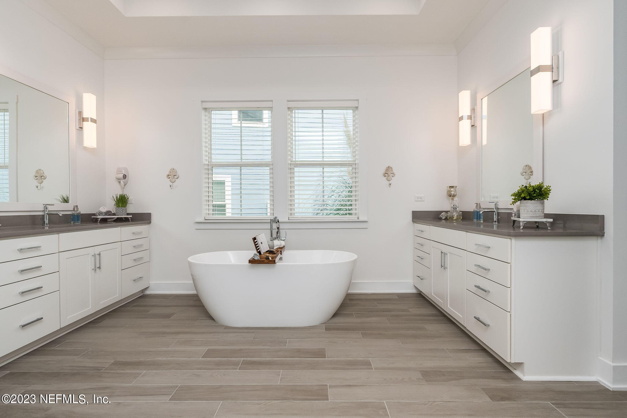 57 Topside Dr. St. Johns, FL 32259 - Photo 19 of 46 a spacious bathroom with double vanity and a bathtub