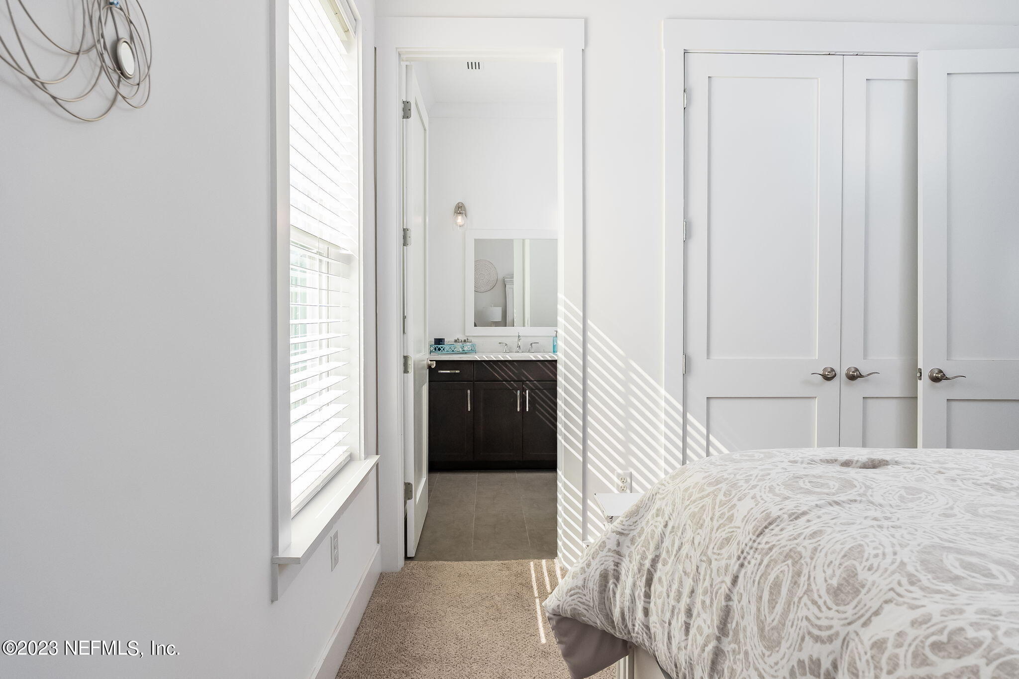 57 Topside Dr. St. Johns, FL 32259 - Photo 23 of 46 a bedroom with a bed and a cabinets