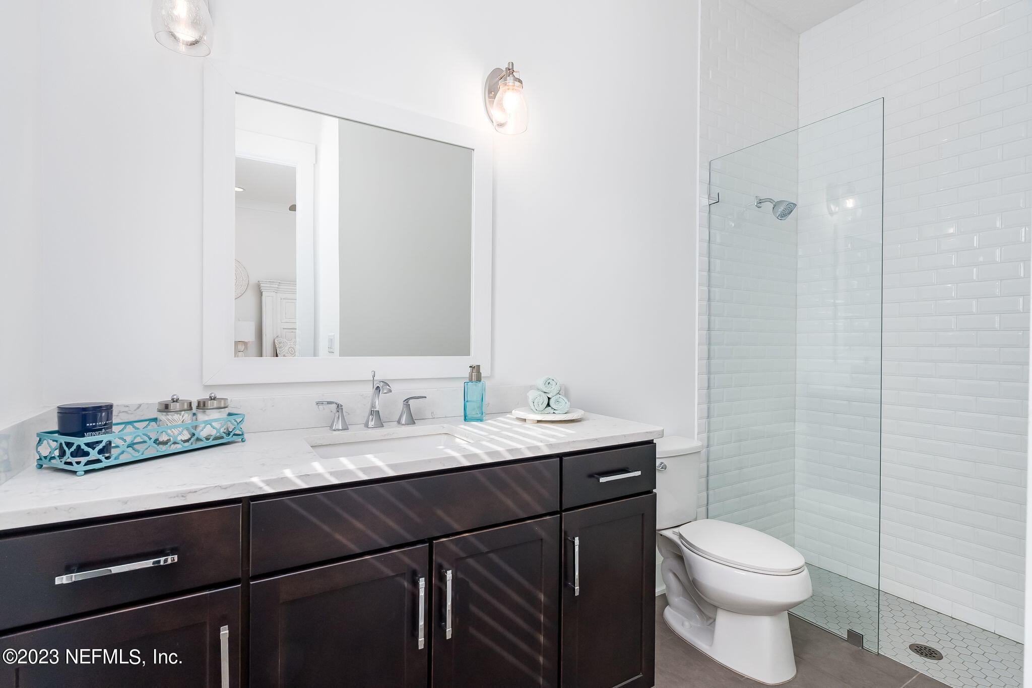 57 Topside Dr. St. Johns, FL 32259 - Photo 24 of 46 a bathroom with a granite countertop sink toilet and mirror