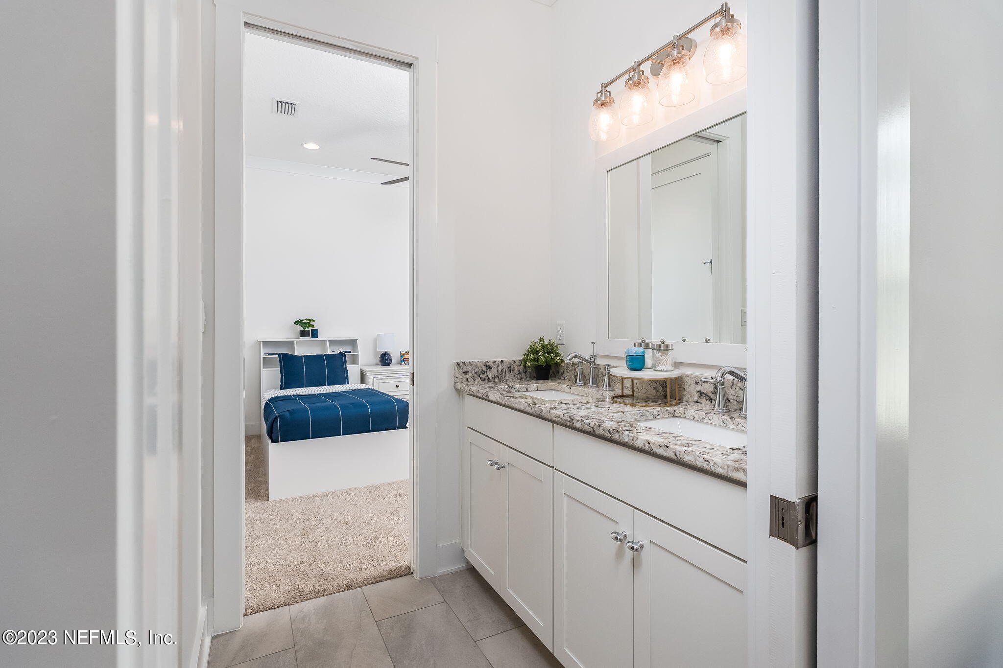 57 Topside Dr. St. Johns, FL 32259 - Photo 26 of 46 a en suite bathroom with a granite countertop sink and a mirror