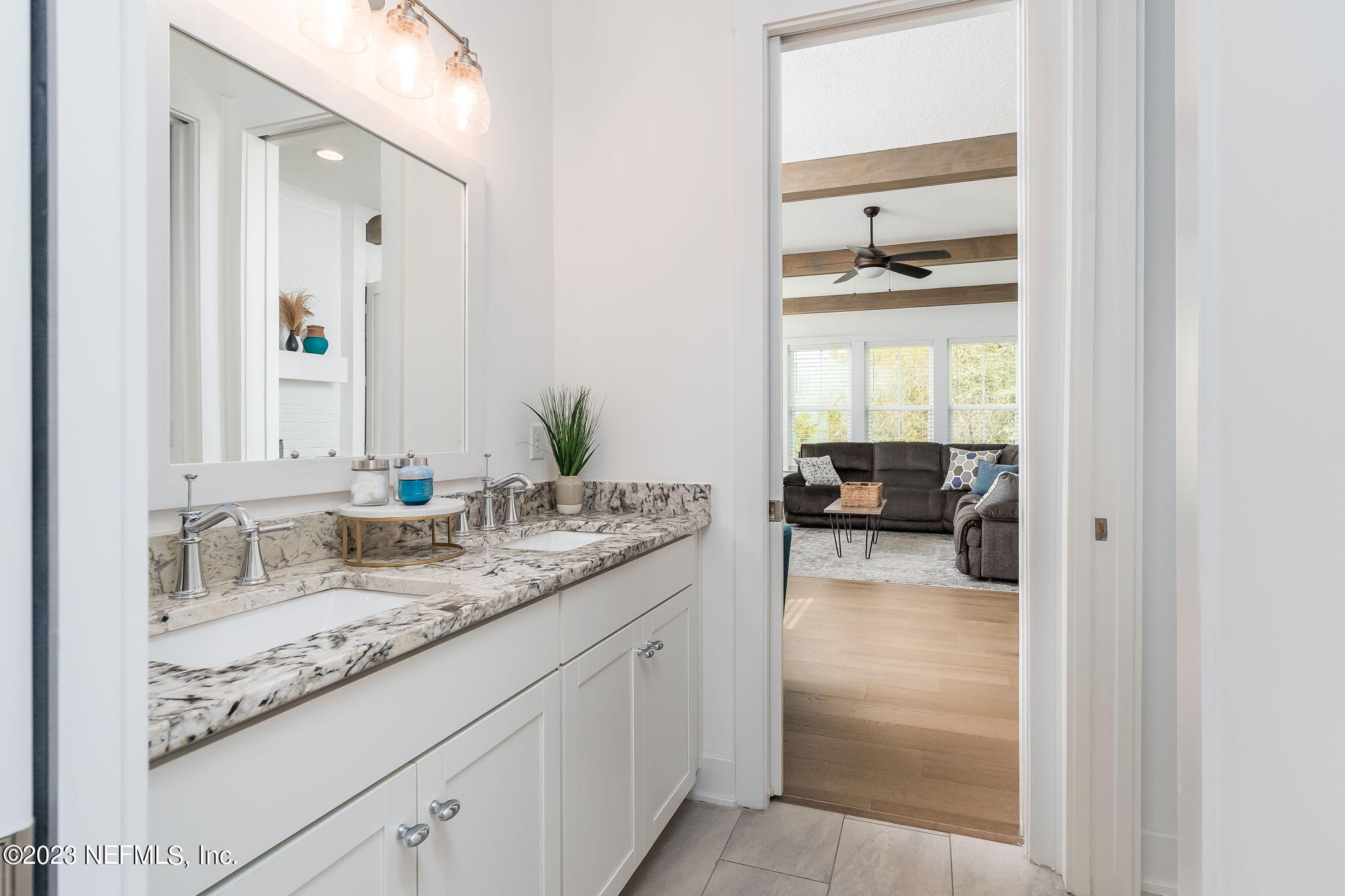 57 Topside Dr. St. Johns, FL 32259 - Photo 27 of 46 a en suite bathroom with a granite countertop sink and a mirror
