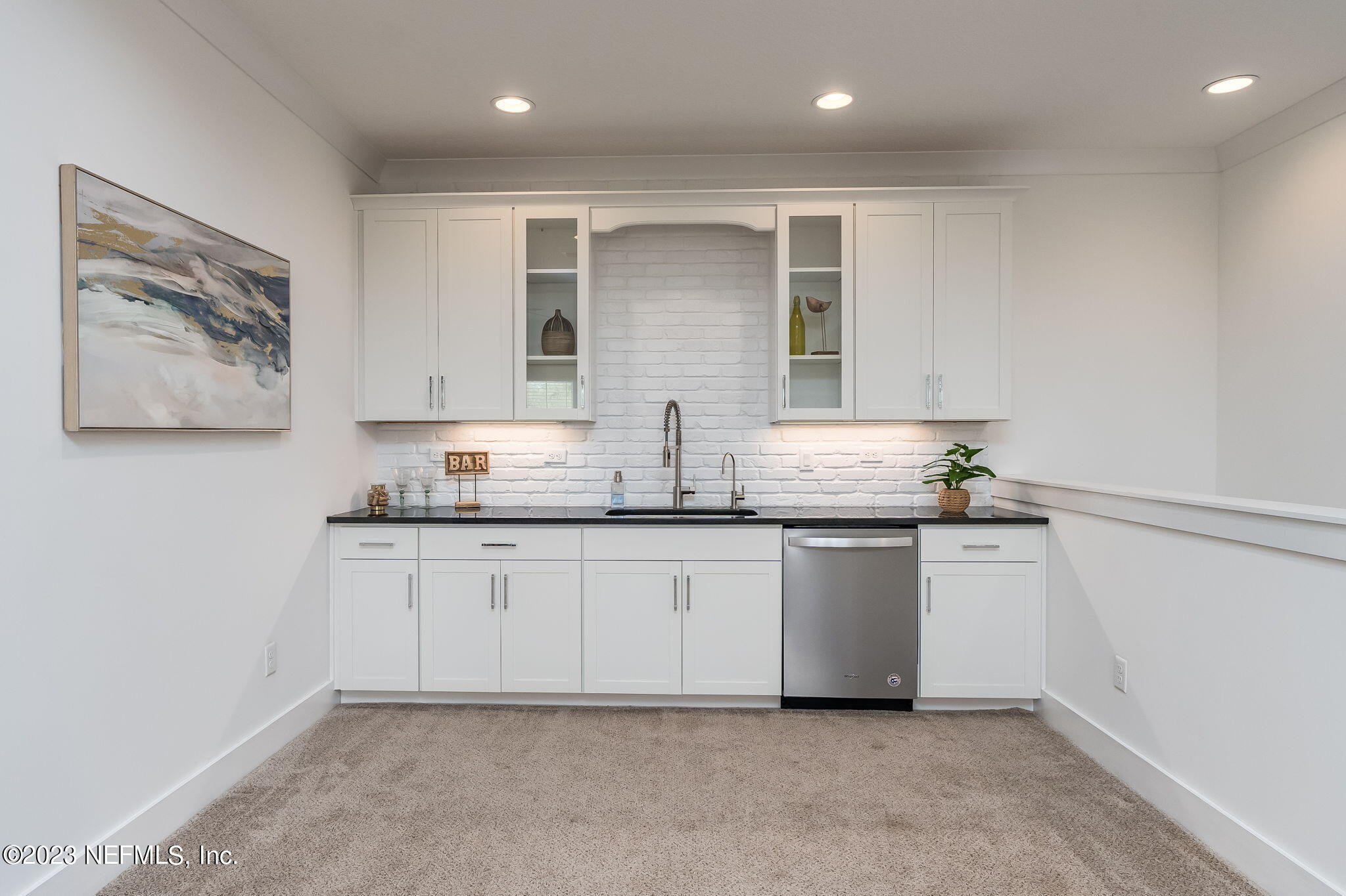 57 Topside Dr. St. Johns, FL 32259 - Photo 35 of 46 a kitchen with granite countertop white cabinets and white appliances