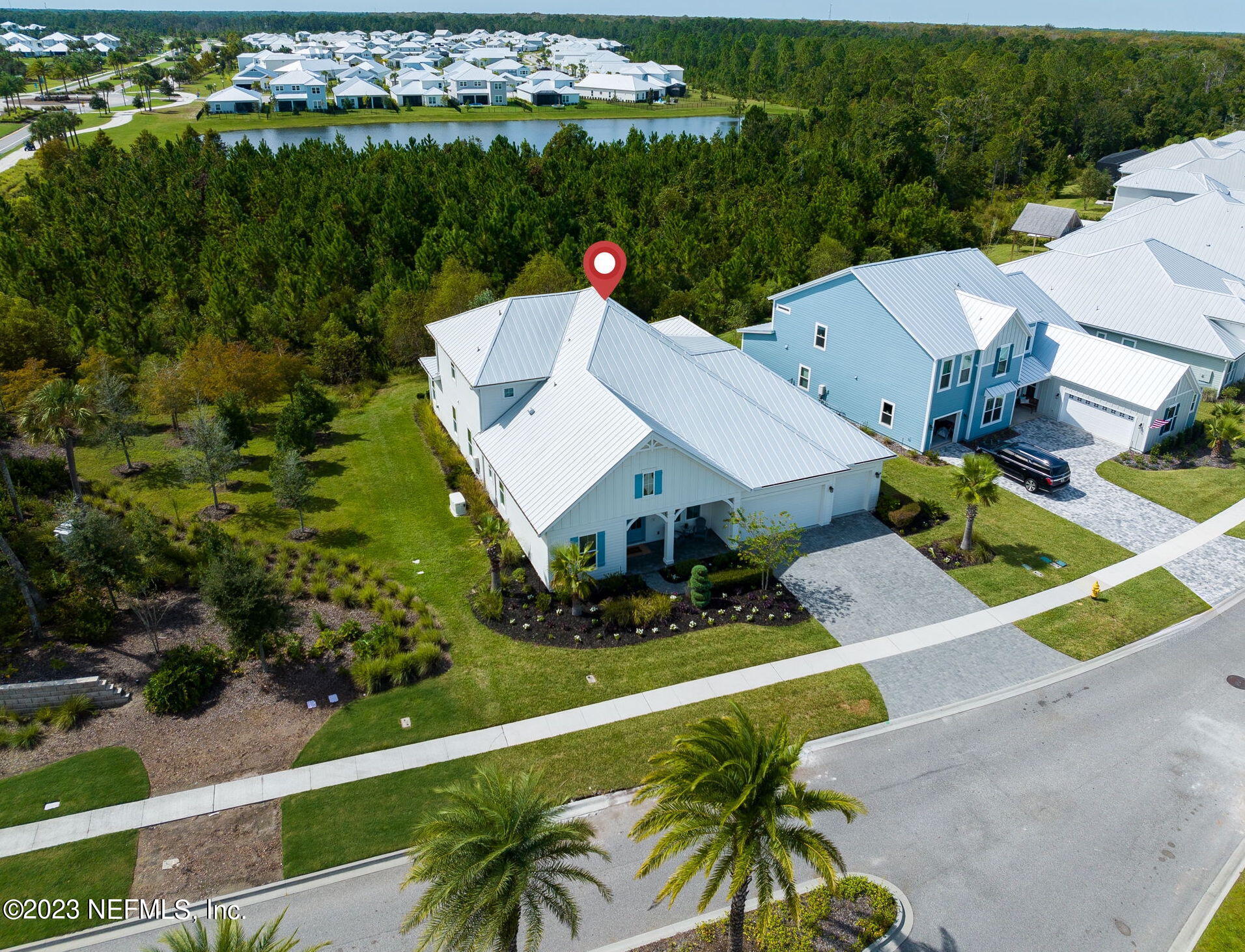 57 Topside Dr. St. Johns, FL 32259 - Photo 41 of 46 an aerial view of a house with a big yard and potted plants