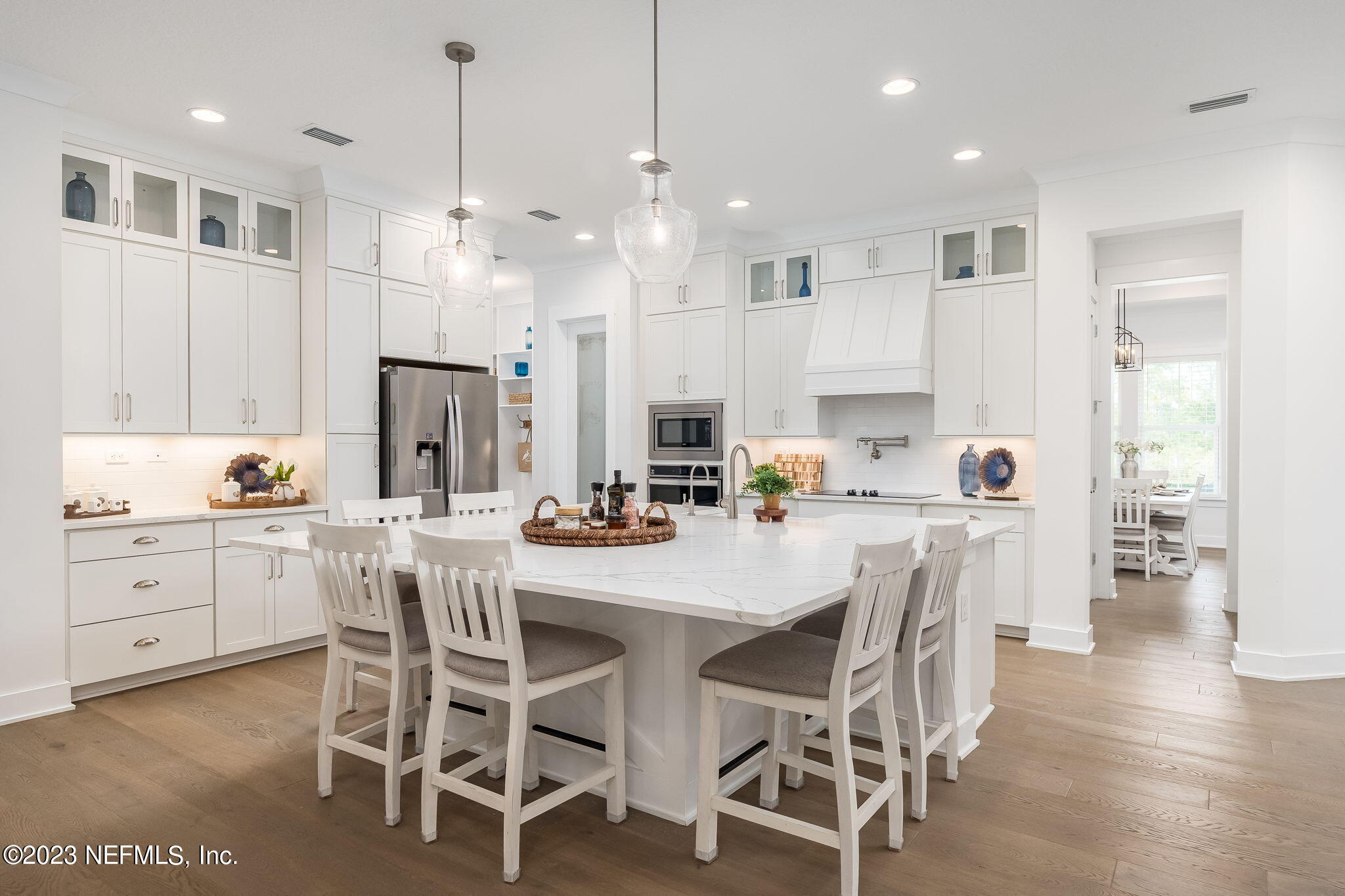 57 Topside Dr. St. Johns, FL 32259 - Photo 7 of 46 a large kitchen with cabinets a sink a center island stainless steel appliances and cabinets