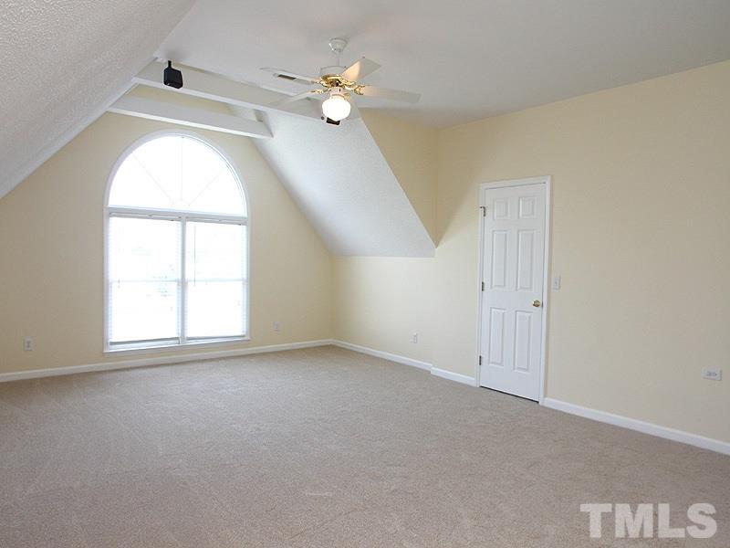 2305 Kendricks Court Raleigh, NC 27613 - Photo 14 of 23 an empty room with windows and ceiling fan
