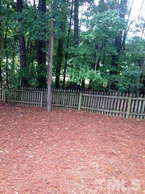 2305 Kendricks Court Raleigh, NC 27613 - Photo 22 of 23 a view of outdoor space with wooden fence