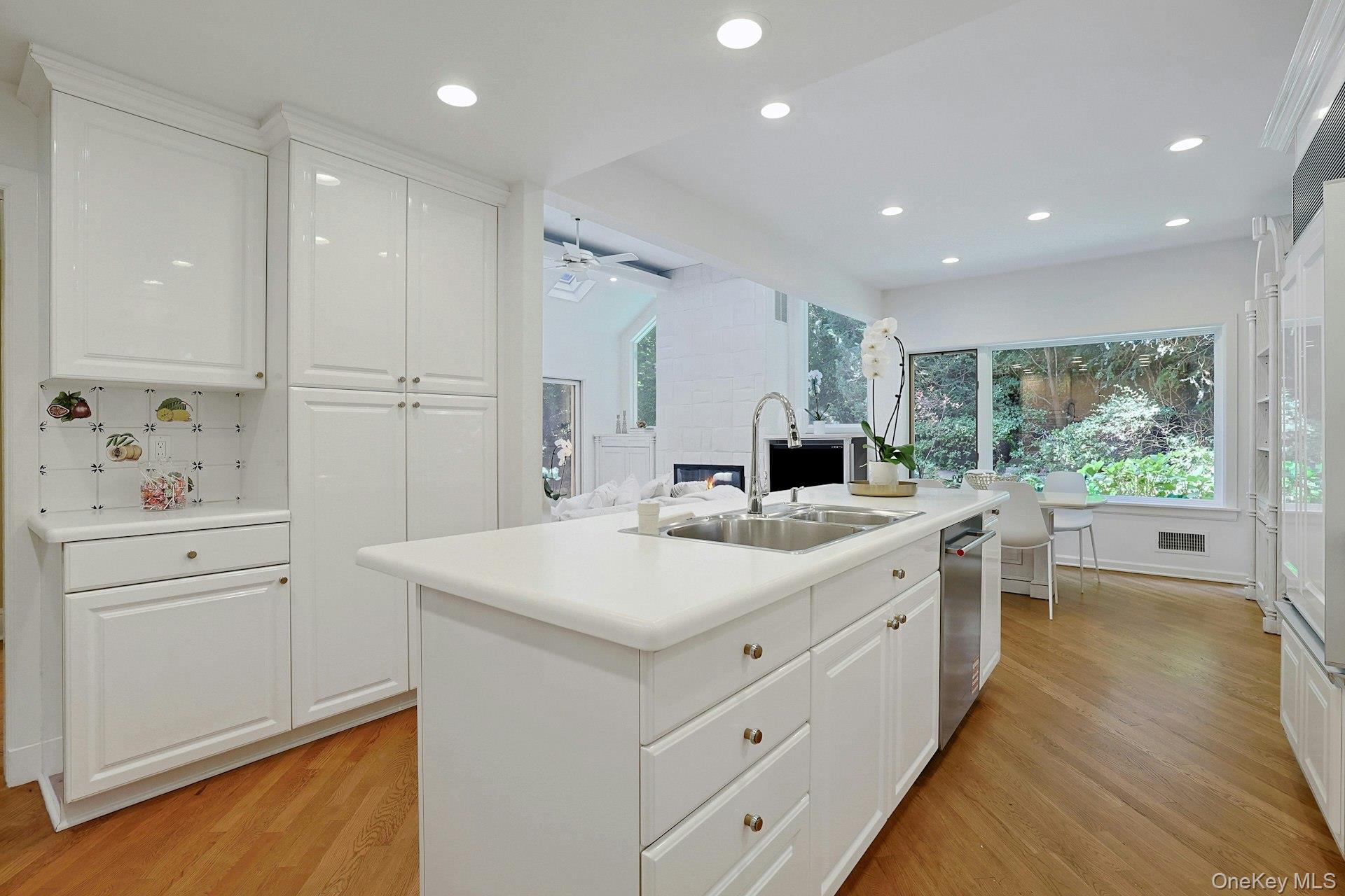 17 Elm Road Scarsdale, NY 10583 - Photo 10 of 38 Abundant cabinetry and counter space combine with the generous island to create a highly functional kitchen that flows directly into the adjoining living spaces.