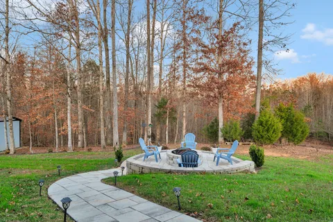 a view of a park with large trees