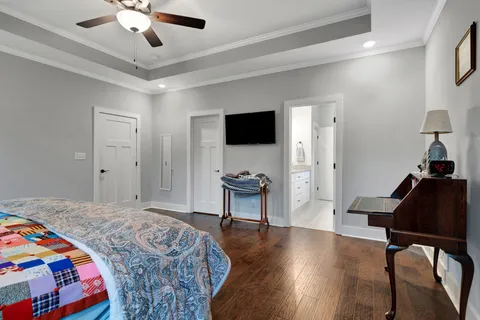 a bedroom with furniture and a window