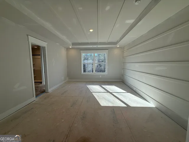 a view of empty room with windows