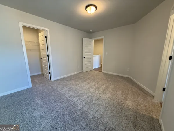 a view of empty room with windows