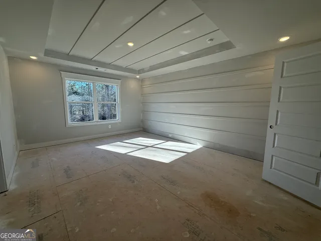 a spacious bathroom with a double vanity sink a mirror and a shower