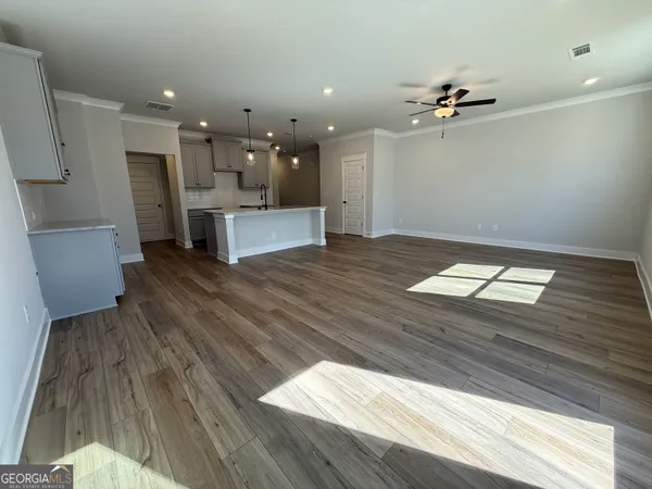 a view of workspace with wooden floor and windows