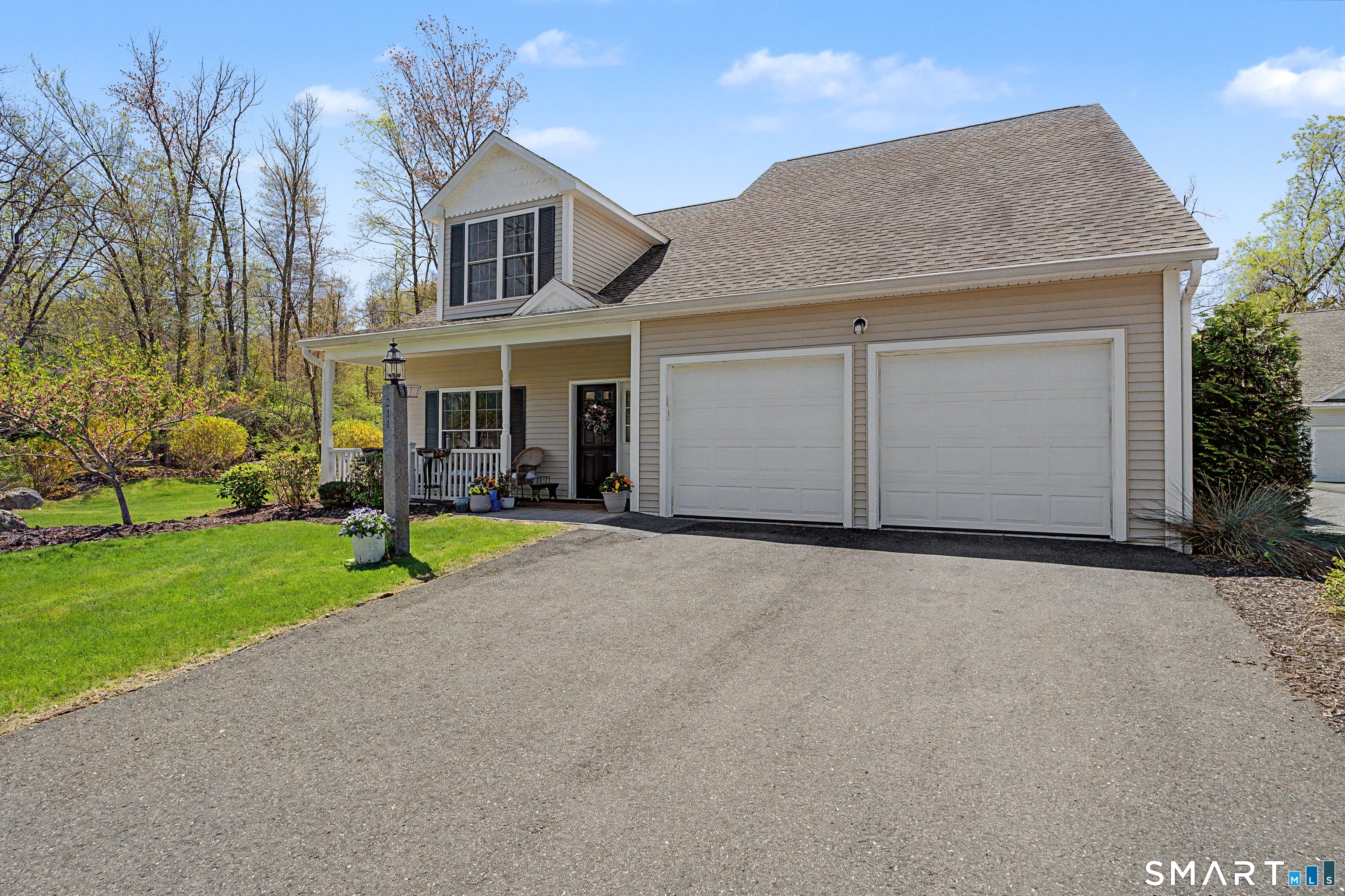 211 Meadowbrook Road, Unit 211 Oxford, CT 06478 - Photo 2 of 38 Inviting curb appeal with a spacious driveway, attached two-car garage, and beautifully maintained exterior, set on a picturesque lot.