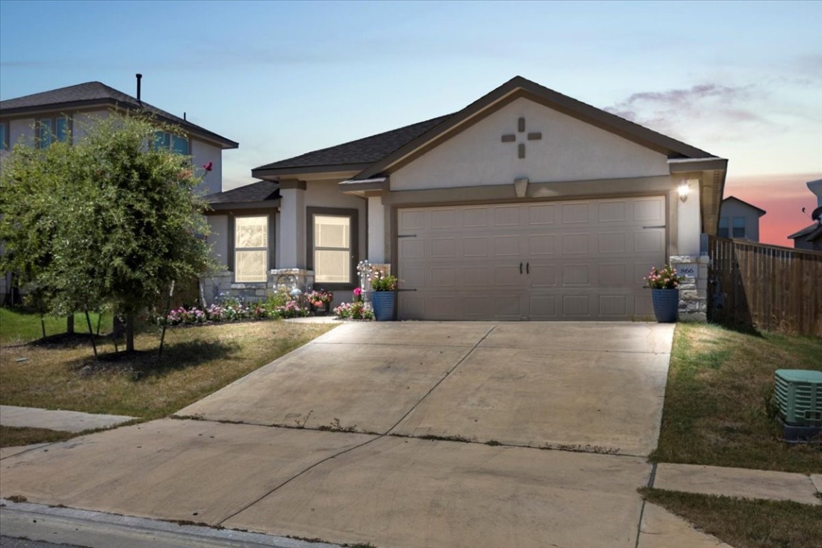 a front view of a house with yard