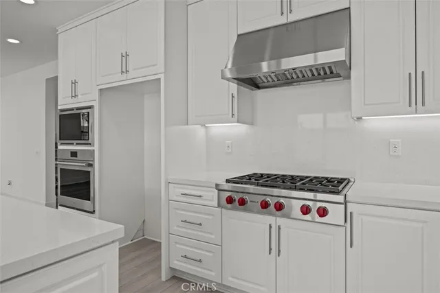 a kitchen with appliances cabinets and a counter top
