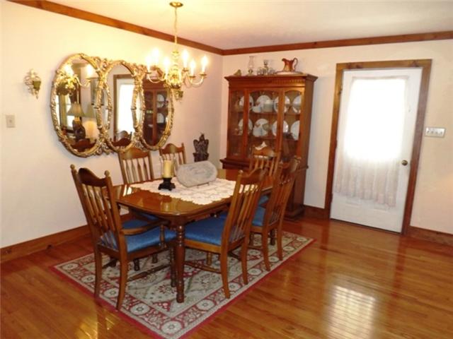 1278 Spence Road Camden, TN 38320 - Photo 13 of 20 a view of a dining room with furniture window and wooden floor