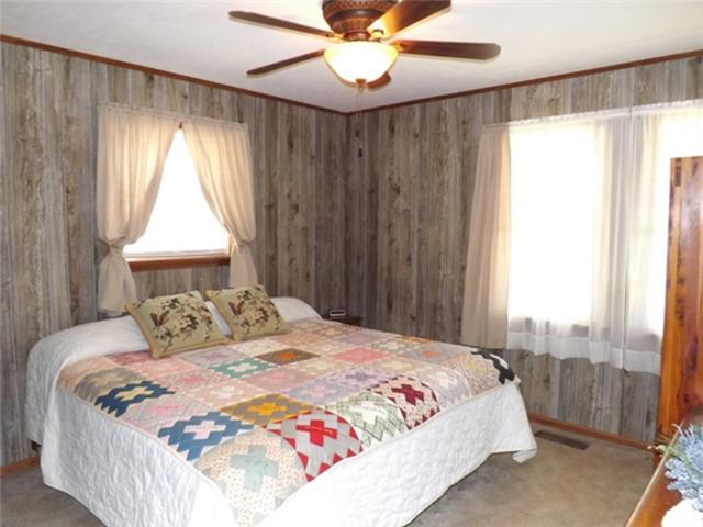 1278 Spence Road Camden, TN 38320 - Photo 15 of 20 a bedroom with a bed and a window