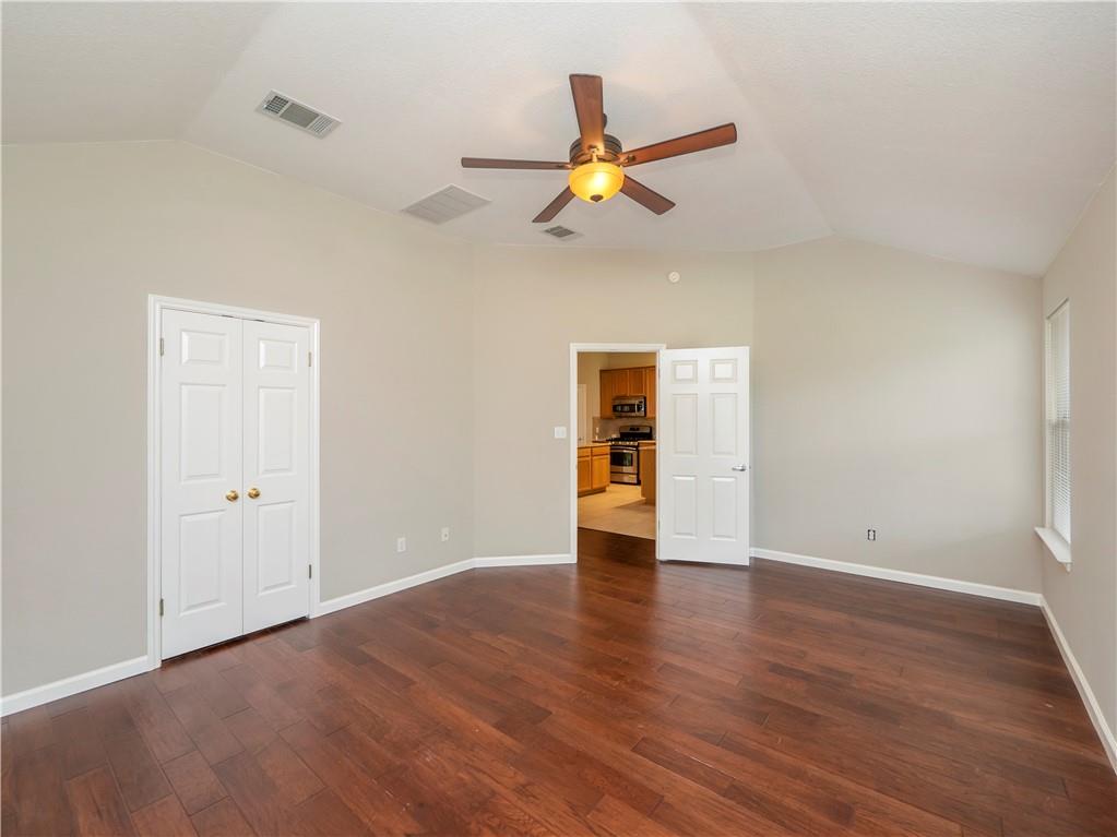 2206 Boneset Trail Round Rock, TX 78665 - Photo 18 of 35 a view of an empty room with window and wooden floor