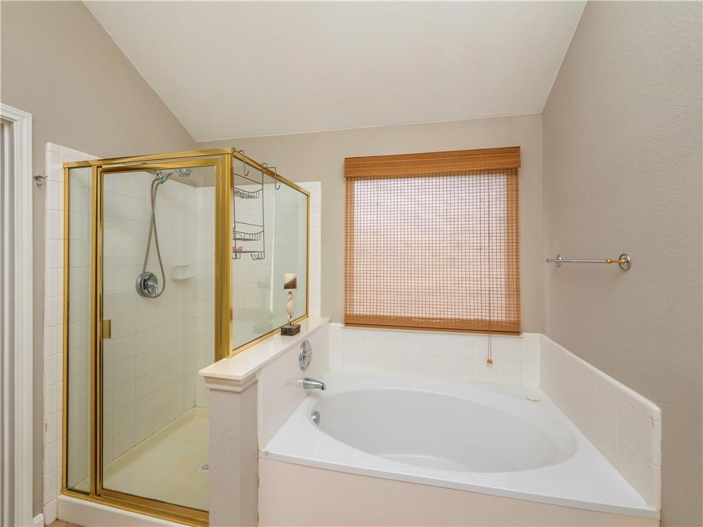 2206 Boneset Trail Round Rock, TX 78665 - Photo 20 of 35 a bathroom with a bathtub and a shower