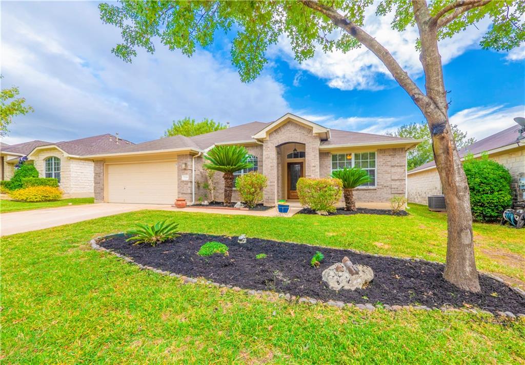 2206 Boneset Trail Round Rock, TX 78665 - Photo 2 of 35 a front view of a house with garden