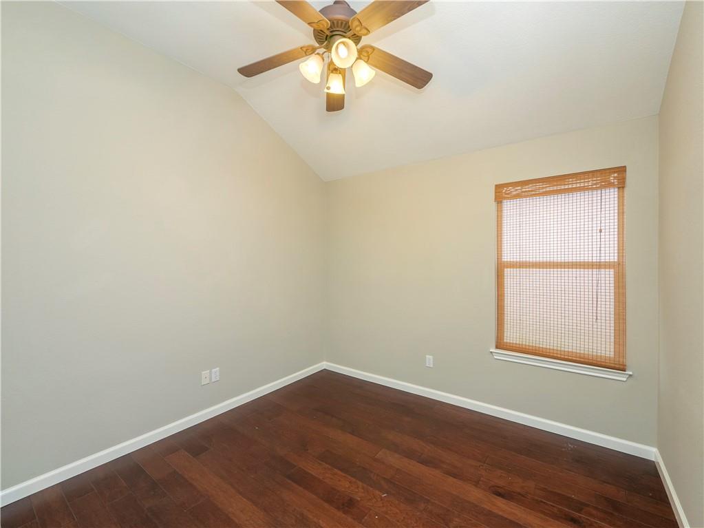 2206 Boneset Trail Round Rock, TX 78665 - Photo 28 of 35 an empty room with a window and a fan