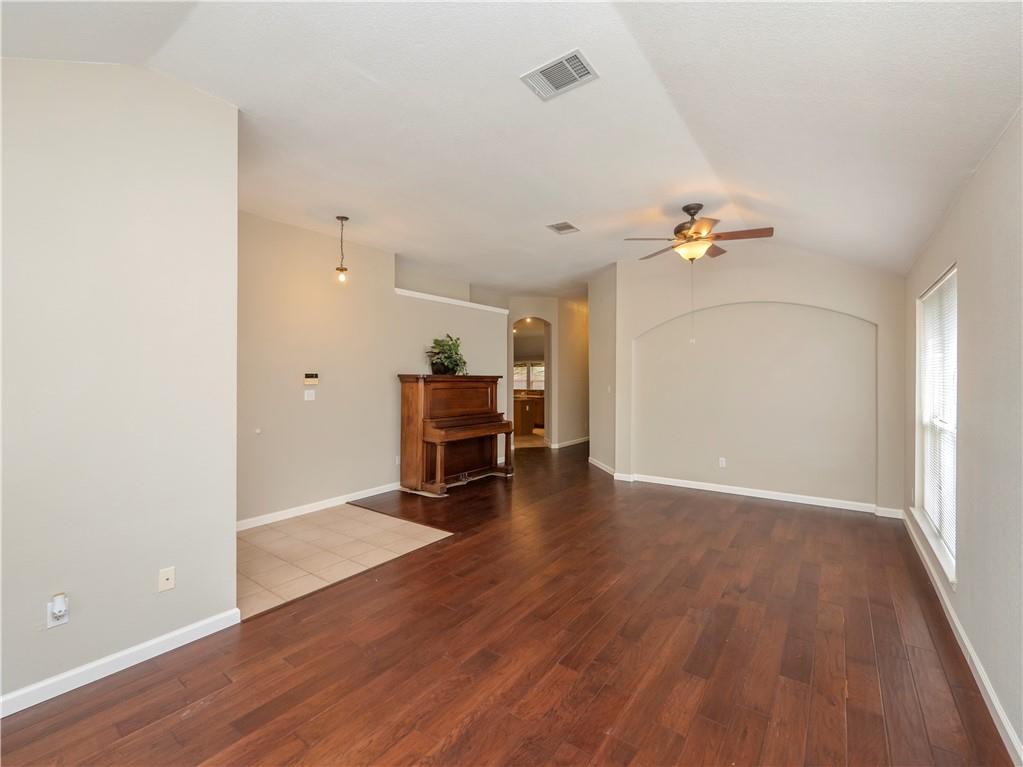 2206 Boneset Trail Round Rock, TX 78665 - Photo 7 of 35 an empty room with wooden floor and furniture