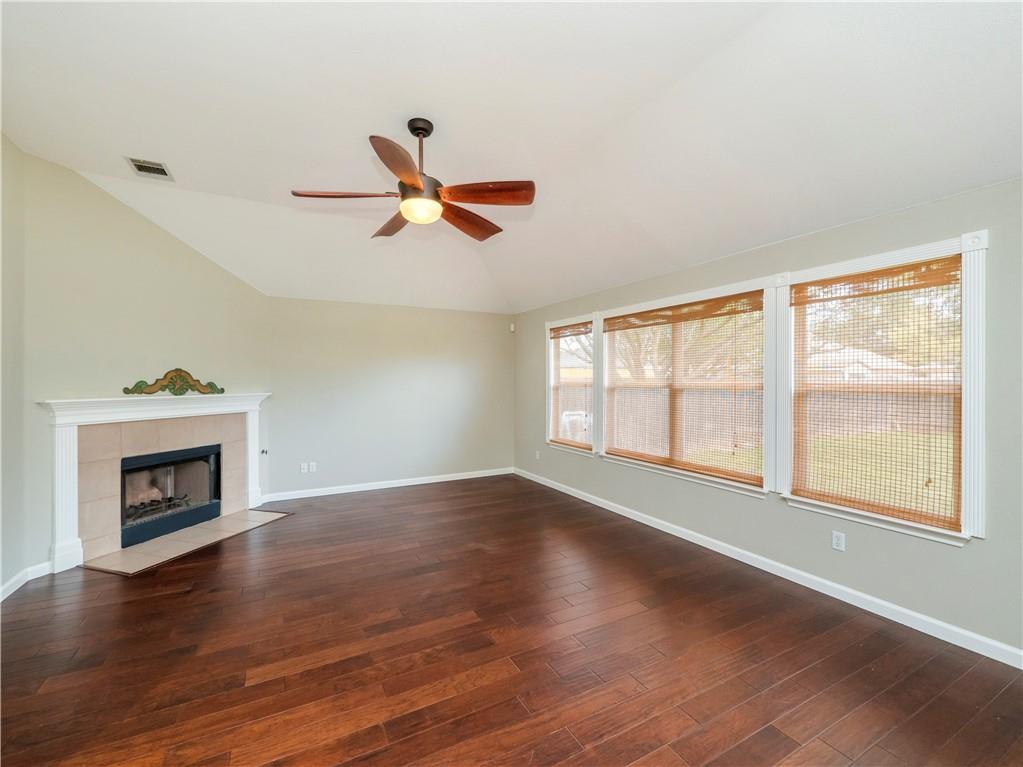 2206 Boneset Trail Round Rock, TX 78665 - Photo 9 of 35 a view of wooden floor fire place and windows in a room