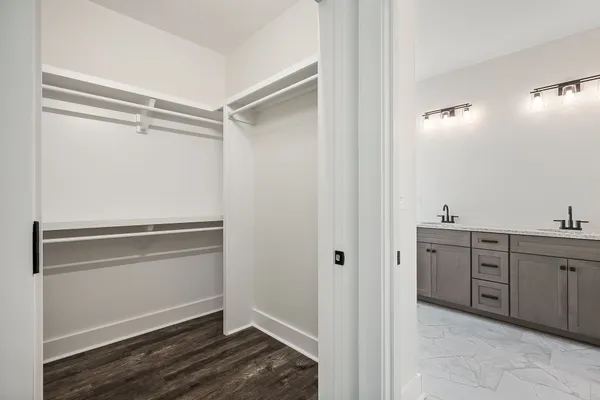a bathroom with a tub shower and sink