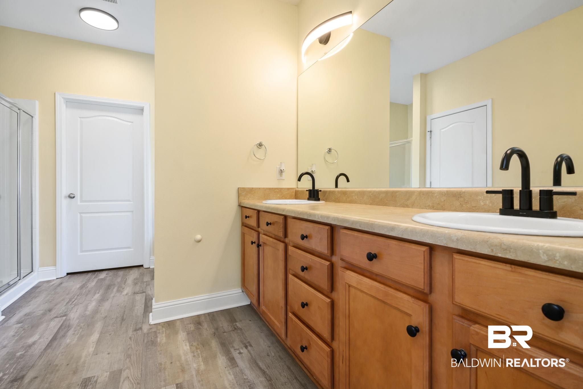 25234 Fairfax Road Daphne, AL 36526 - Photo 21 of 45 Full bathroom with double vanity, light wood-style floors, and a shower stall