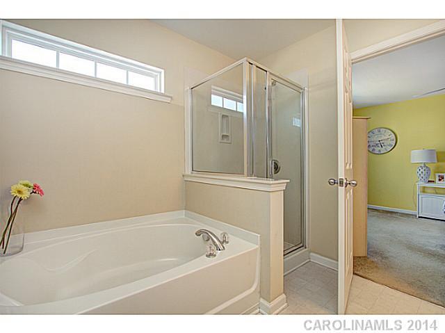 146 Council House Road, Unit 168 Fort Mill, SC 29708 - Photo 11 of 16 a bathroom with a tub shower and sink