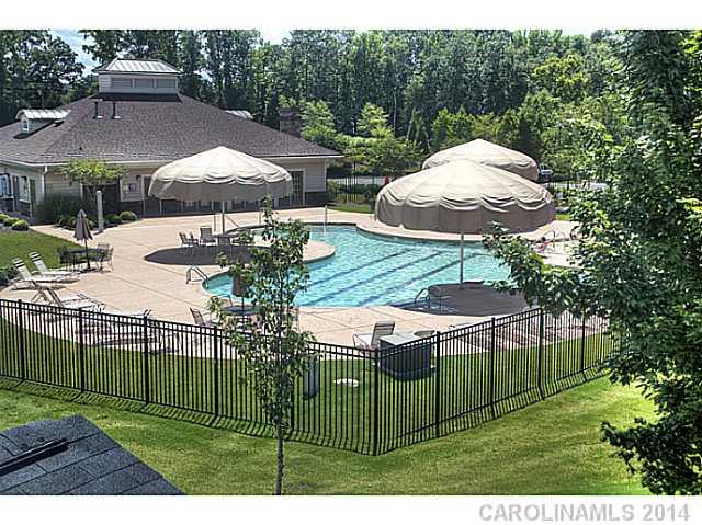 146 Council House Road, Unit 168 Fort Mill, SC 29708 - Photo 16 of 16 a view of a house with backyard outdoor seating and hardwood
